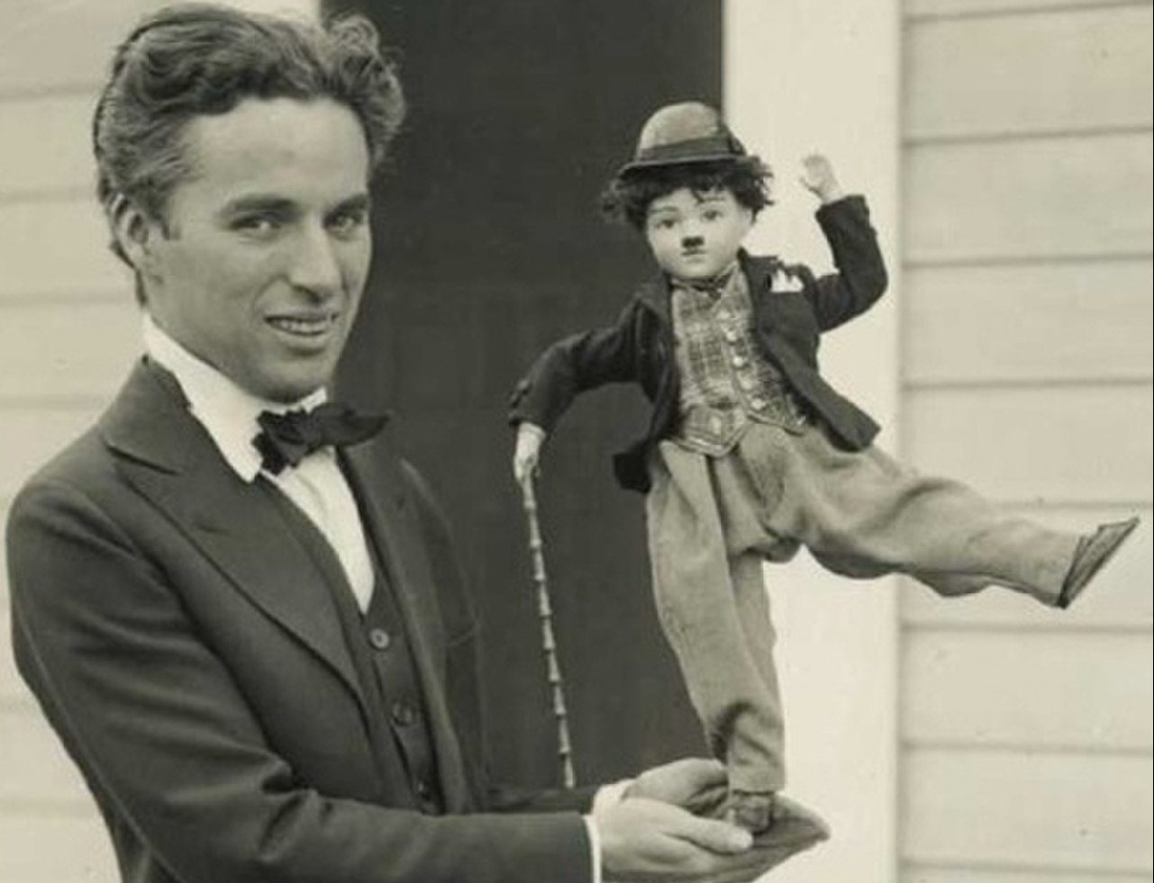1280px Charlie Chaplin with doll e1679832765189